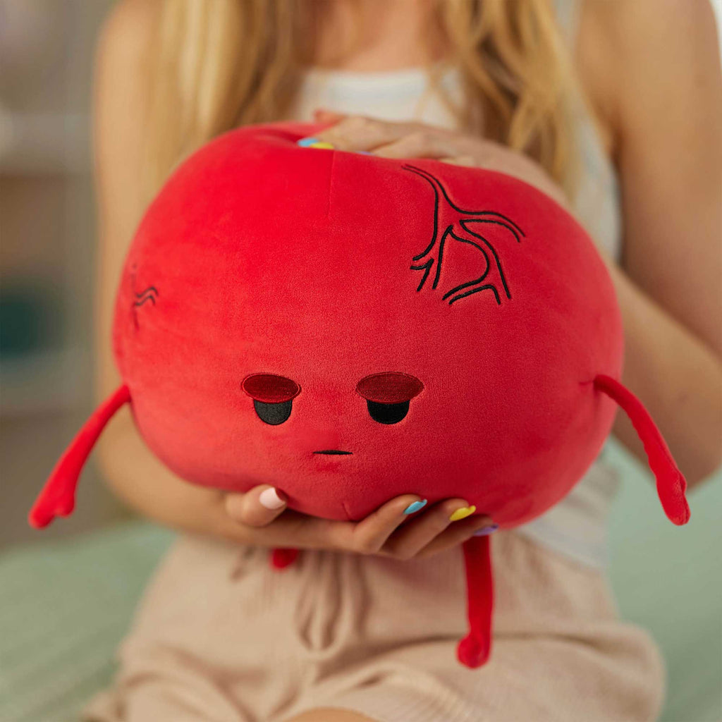red plushie being cuddled