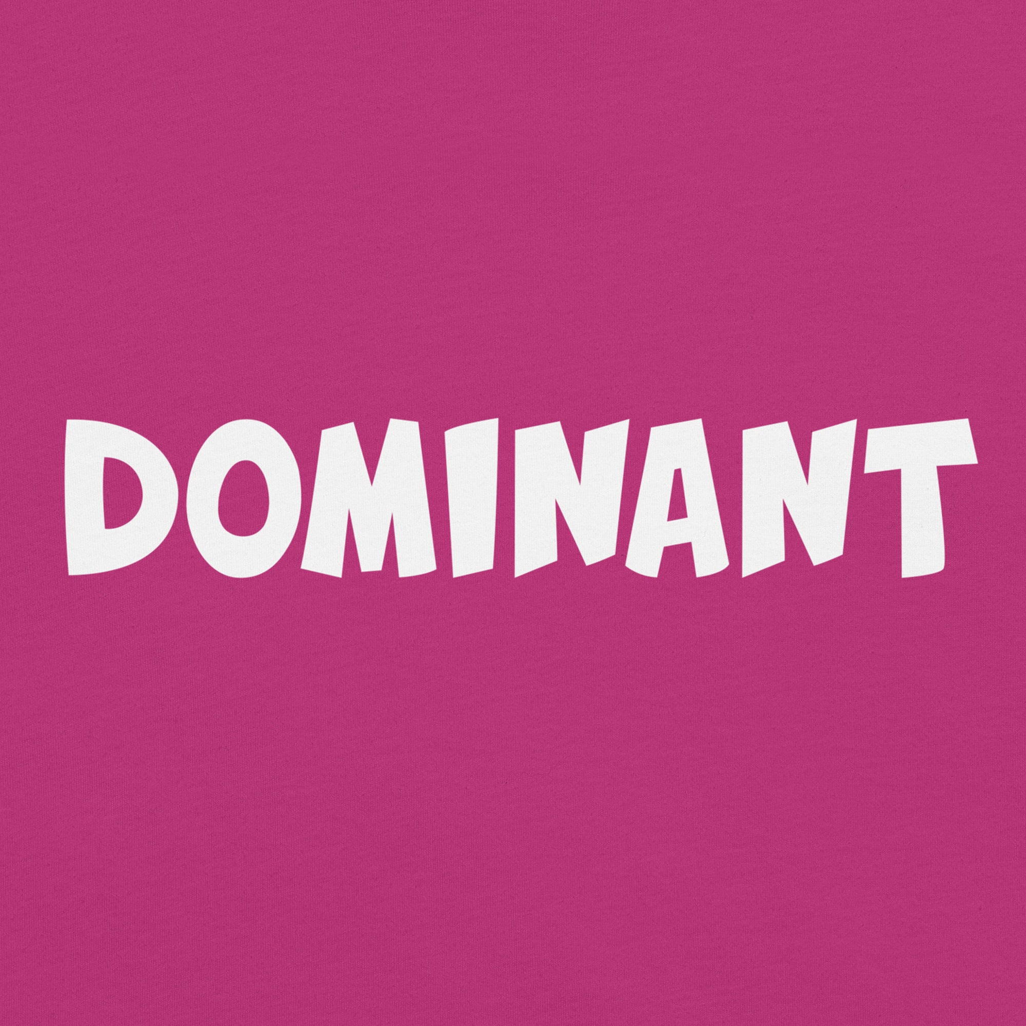 closeup of pink tshirt with the words dominant written on it in the doomlings font