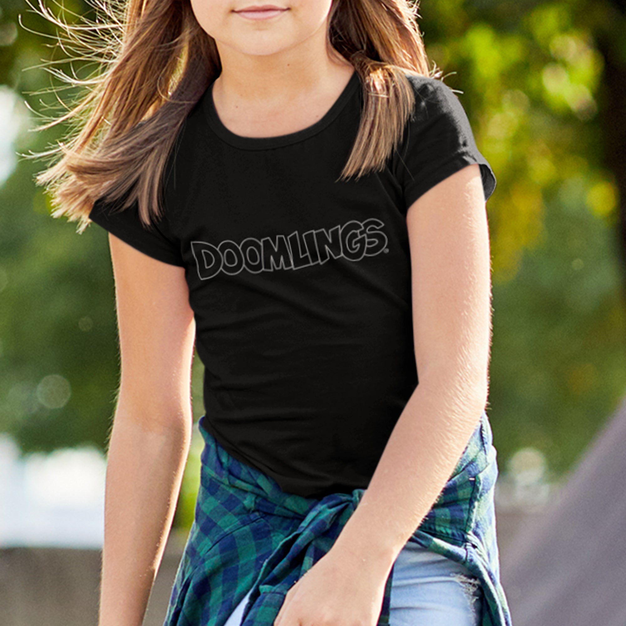 girl wearing doomlings logo on a black tshirt