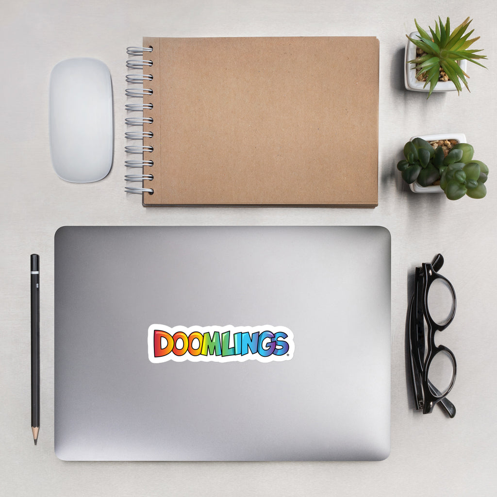 doomlings logo sticker on a latptop