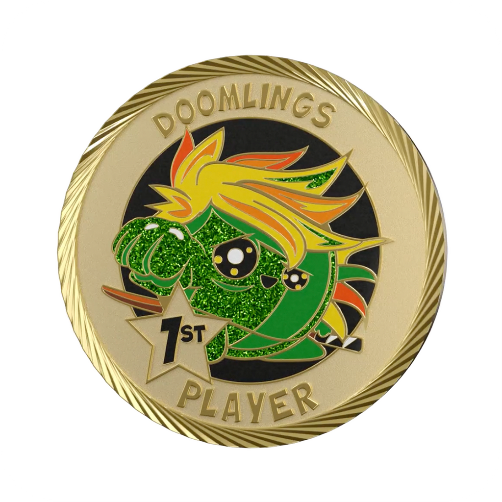 mane doomlings first player medallion coin, gold coin that says doomlings 1st player with cute art of a green character with giant anime hair.